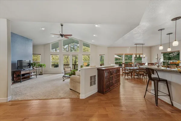 a large kitchen with a table and chairs