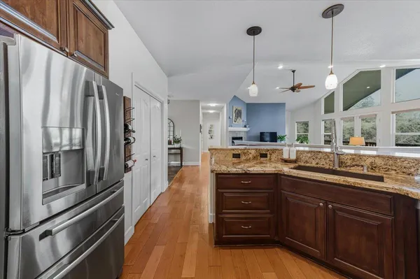 a kitchen with a stove and a refrigerator