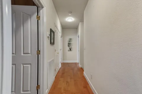 a bedroom with a bed and a night stand