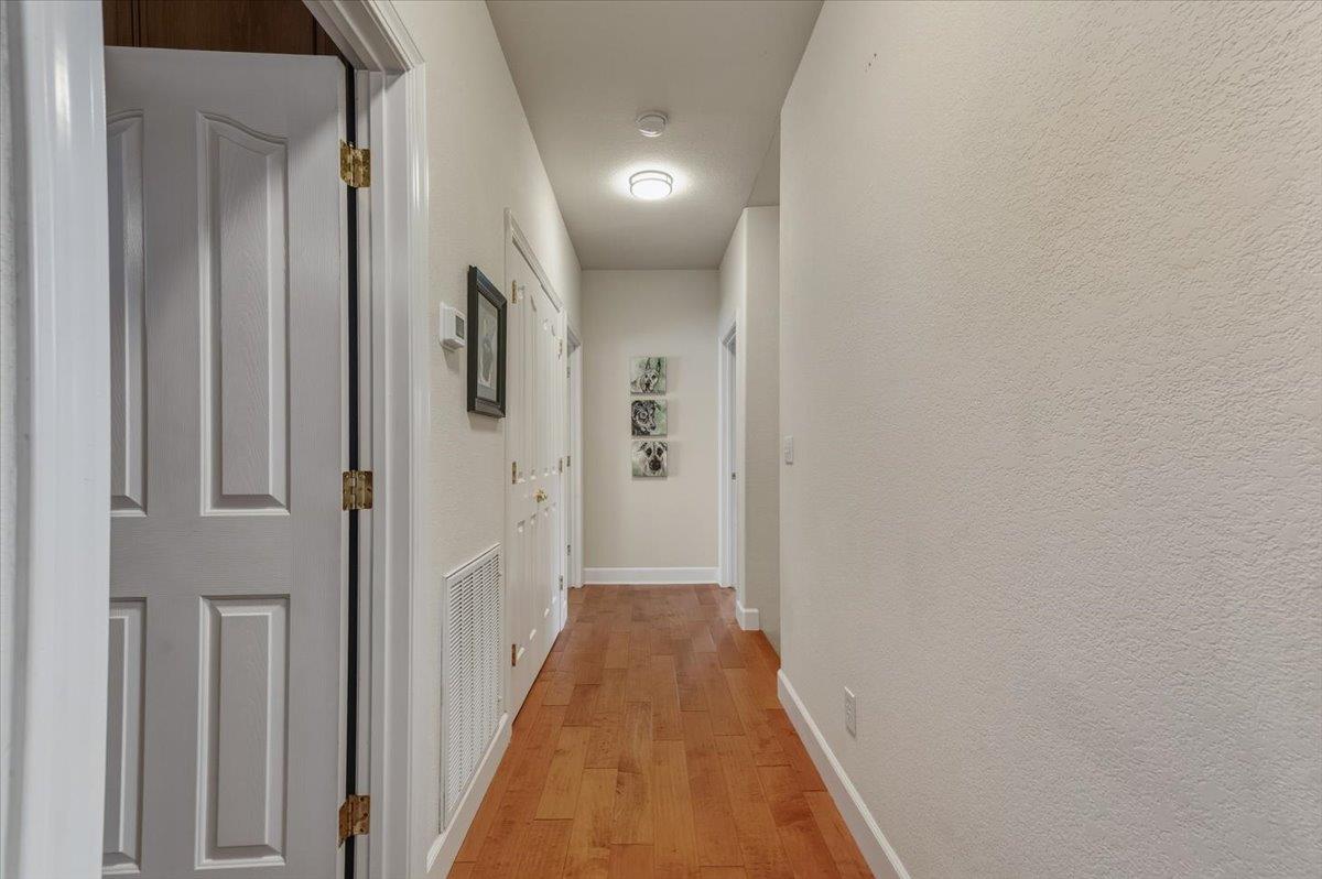 16041 John Way Grass Valley, CA 95949 - Photo 26 of 56 a view of a hallway with wooden floor and closet
