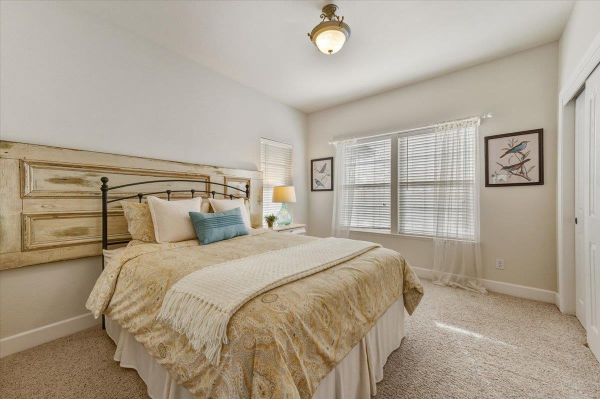 16041 John Way Grass Valley, CA 95949 - Photo 27 of 56 a bed sitting in a bedroom next to a window