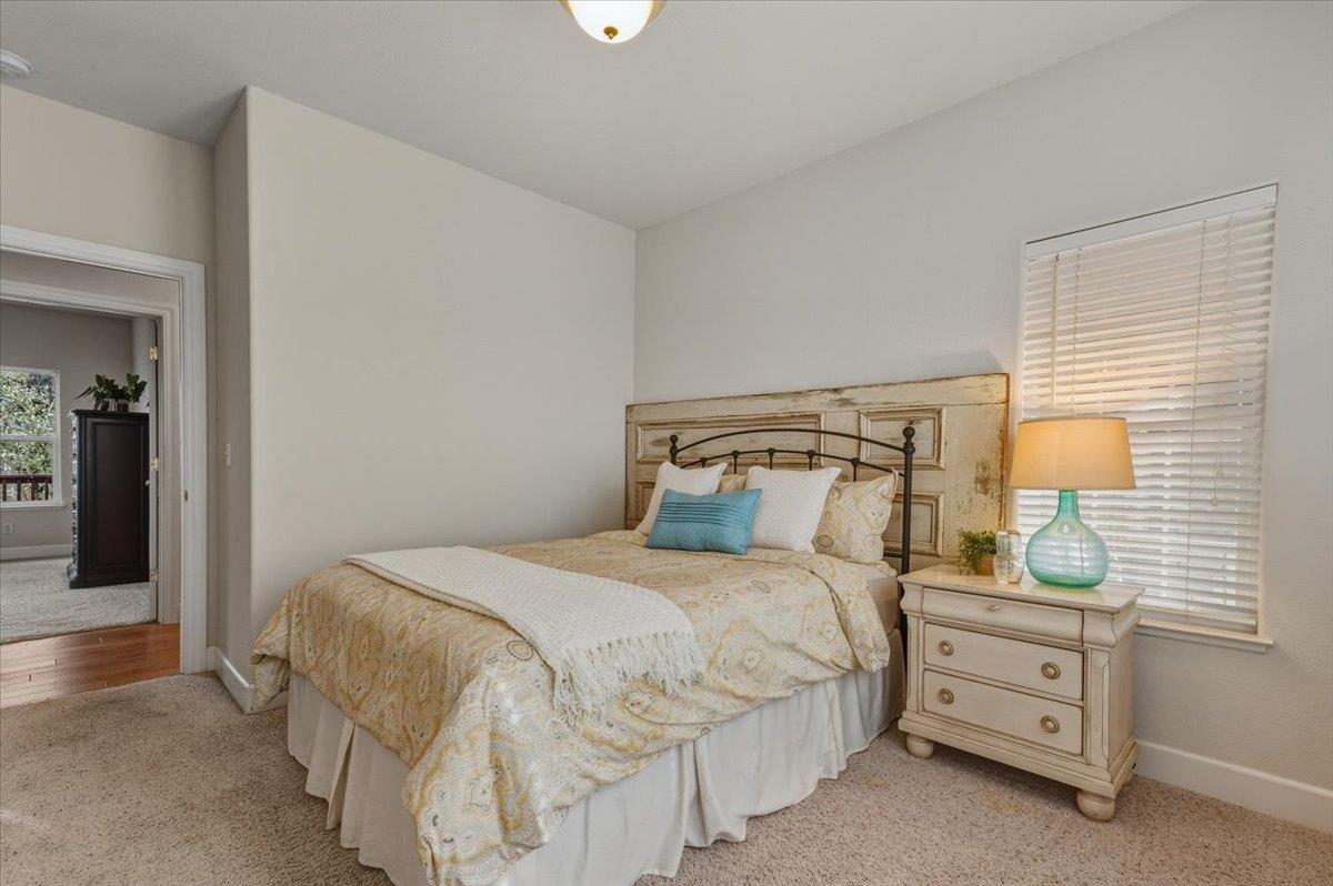 16041 John Way Grass Valley, CA 95949 - Photo 28 of 56 a bedroom with a bed and a night stand