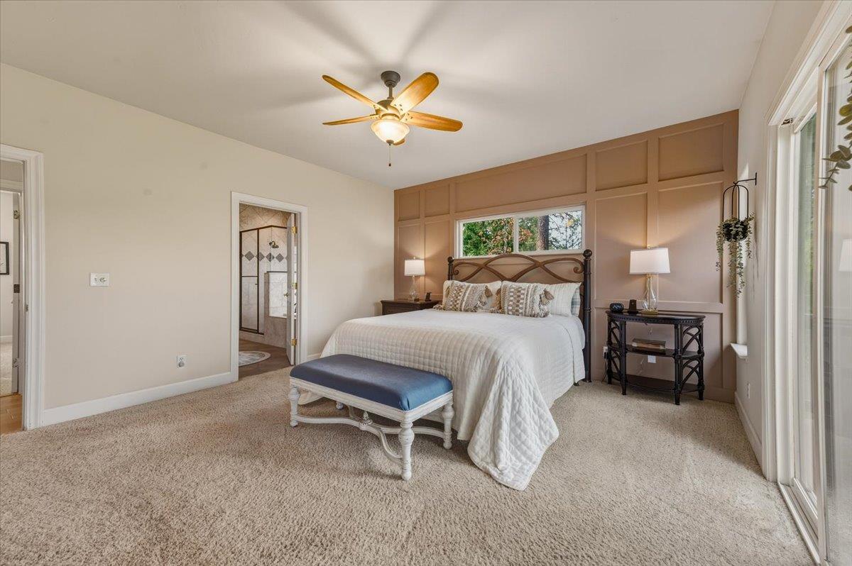 16041 John Way Grass Valley, CA 95949 - Photo 30 of 56 a bedroom with a bed and a chandelier