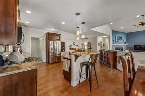 a bed sitting in a spacious bedroom next to a window