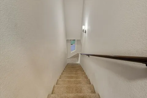 a room with gym equipment and windows