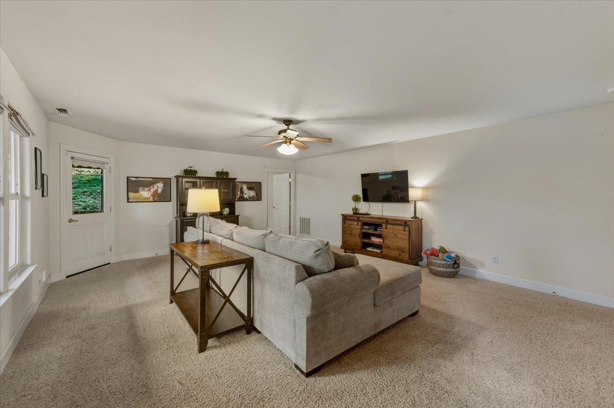16041 John Way Grass Valley, CA 95949 - Photo 37 of 56 a living room with furniture and a flat screen tv