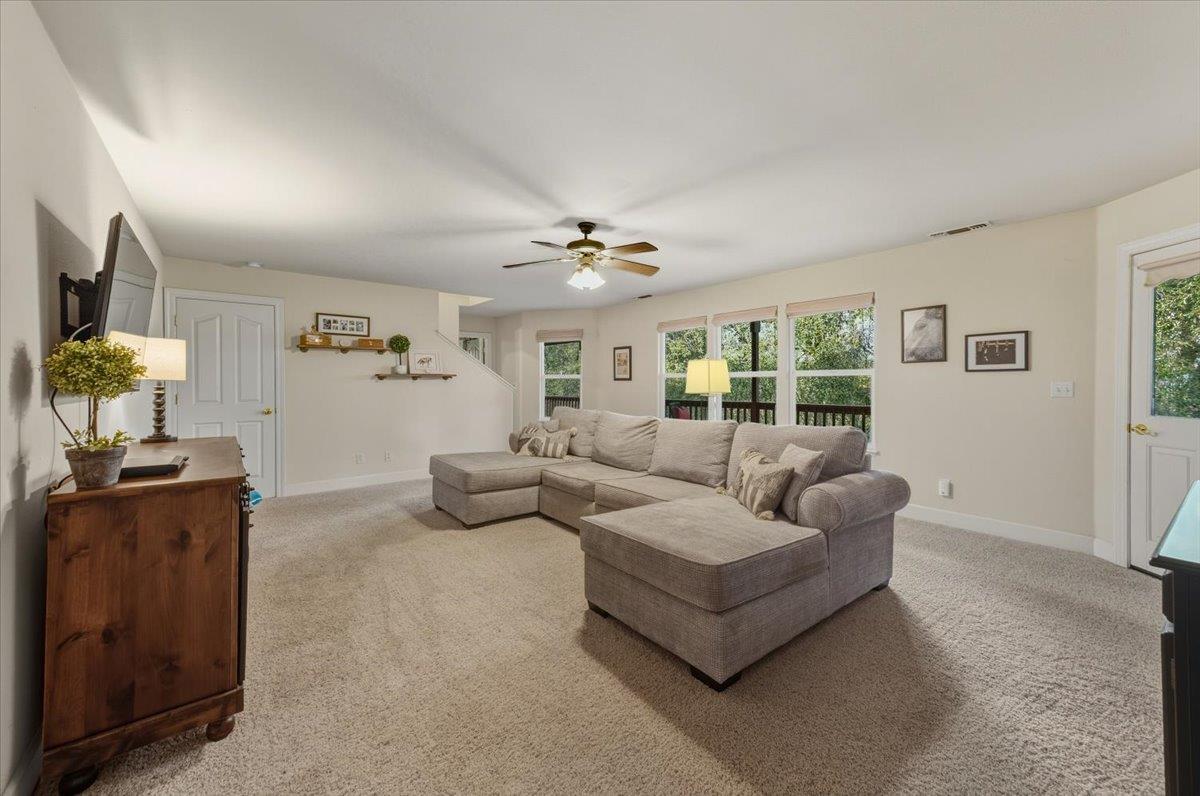 16041 John Way Grass Valley, CA 95949 - Photo 38 of 56 a living room with furniture and a chandelier