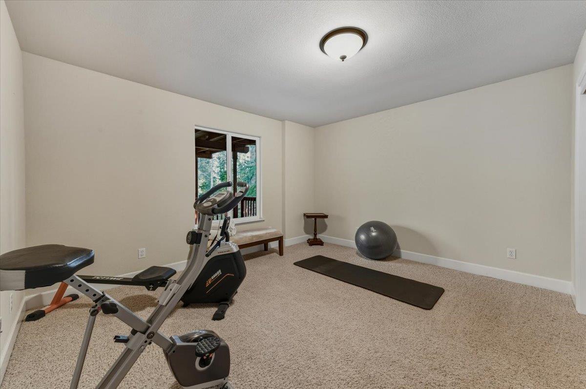 16041 John Way Grass Valley, CA 95949 - Photo 39 of 56 a room with gym equipment and windows