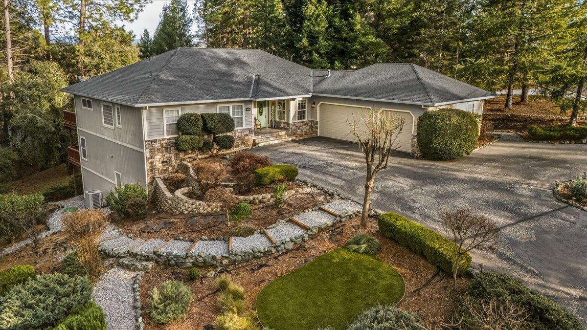 16041 John Way Grass Valley, CA 95949 - Photo 6 of 56 a white house covered with tall trees