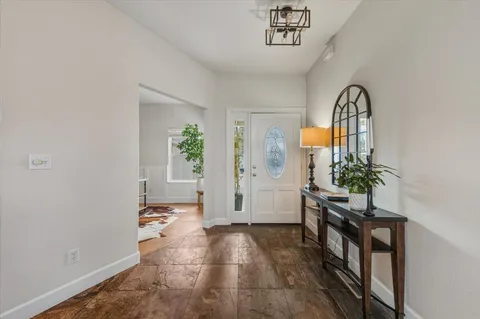 a view of a dining room with furniture and window
