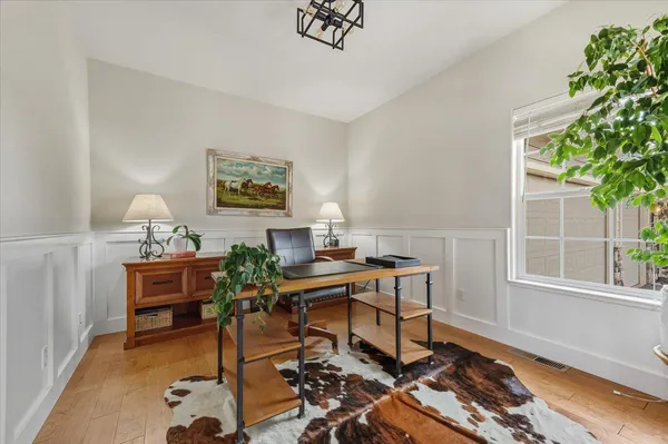 a view of a livingroom with furniture flat screen tv and fireplace