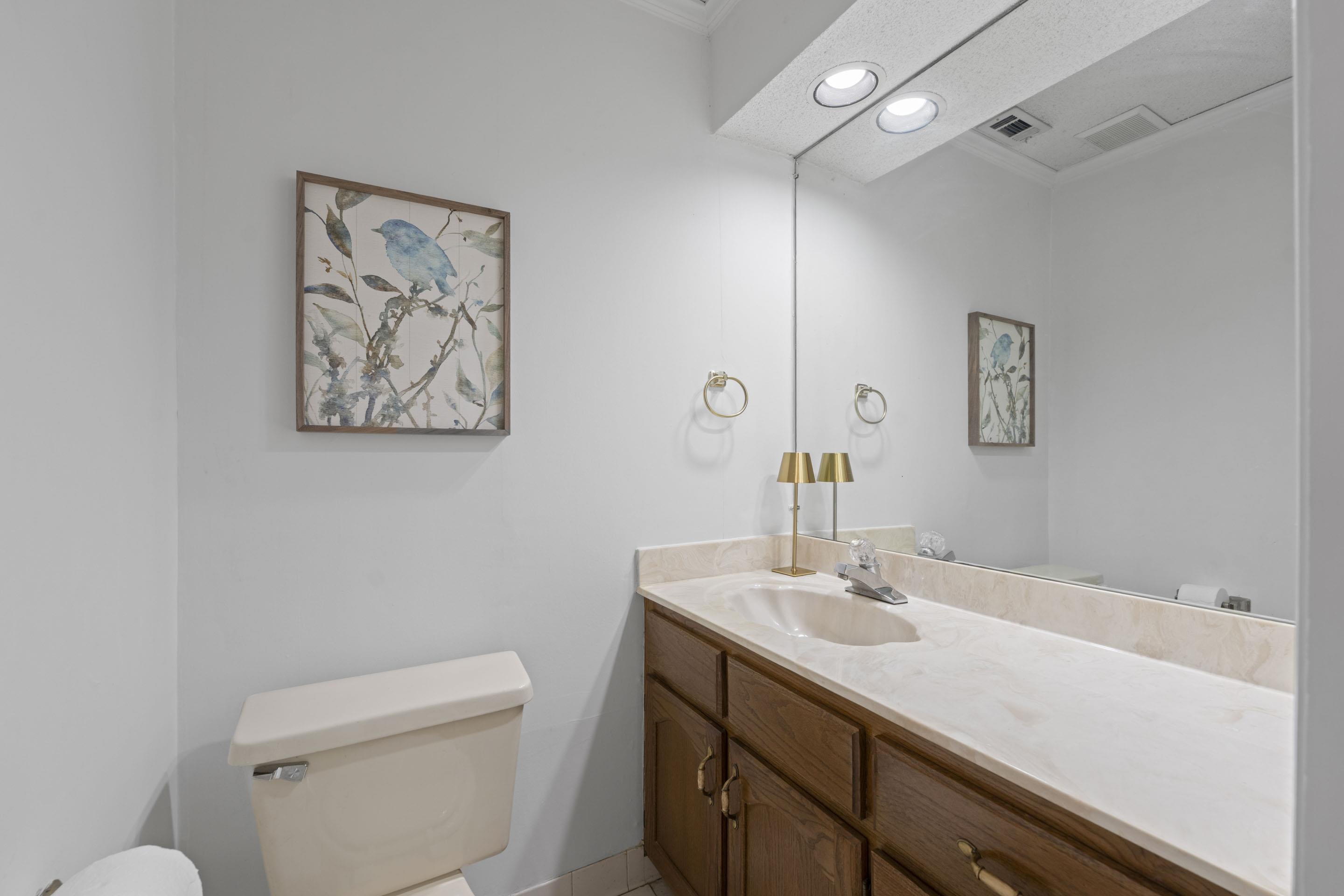 5076 Dee Road Memphis, TN 38117 - Photo 11 of 26 a bathroom with a sink a toilet and a mirror