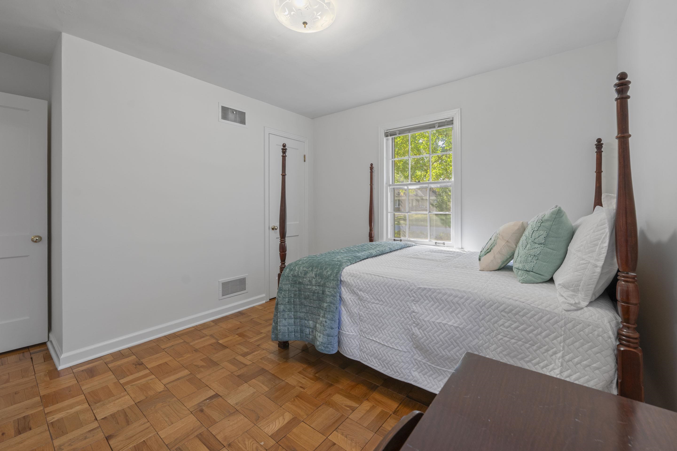 5076 Dee Road Memphis, TN 38117 - Photo 13 of 26 a bedroom with a bed and a window