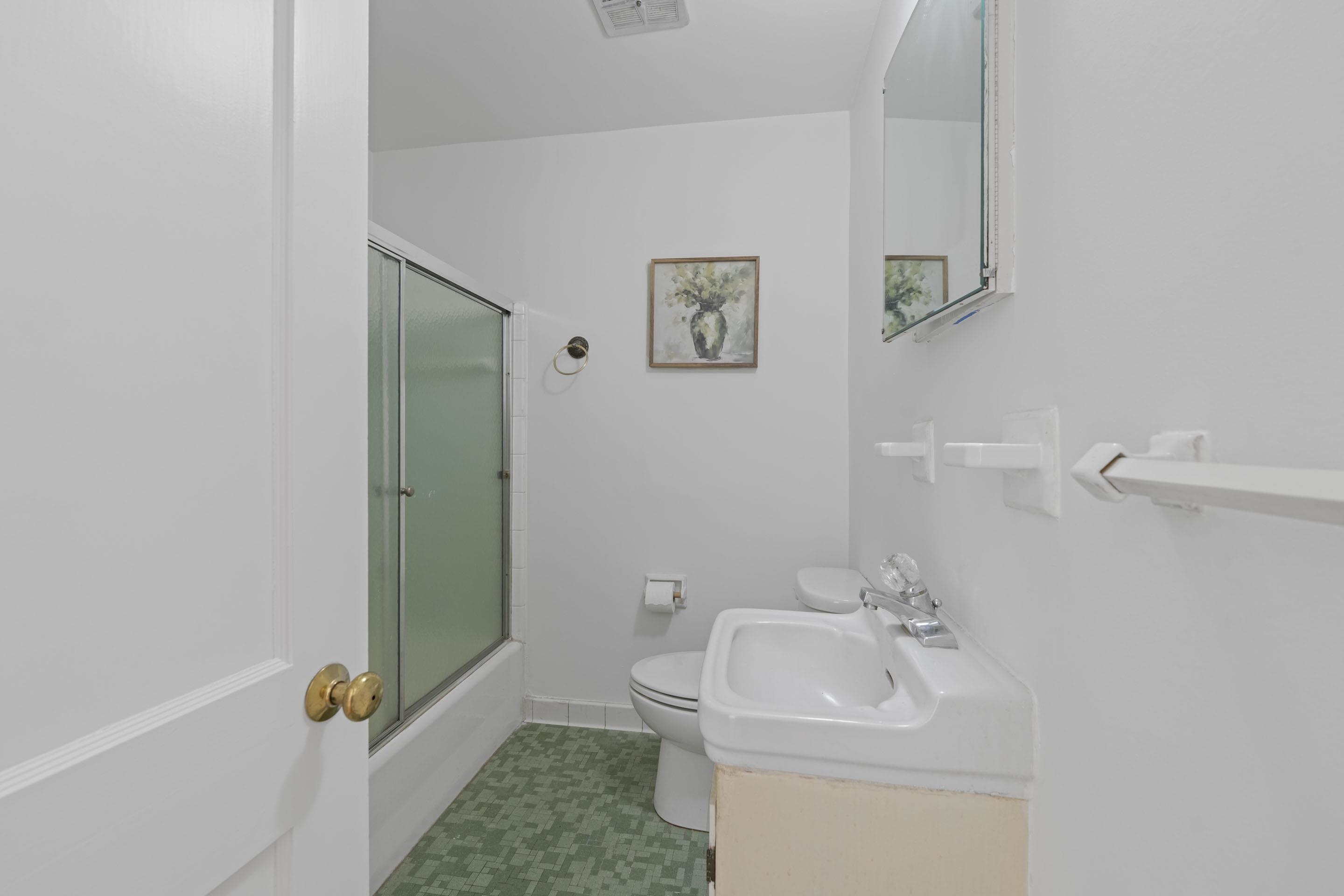 5076 Dee Road Memphis, TN 38117 - Photo 14 of 26 a bathroom with a sink toilet and shower
