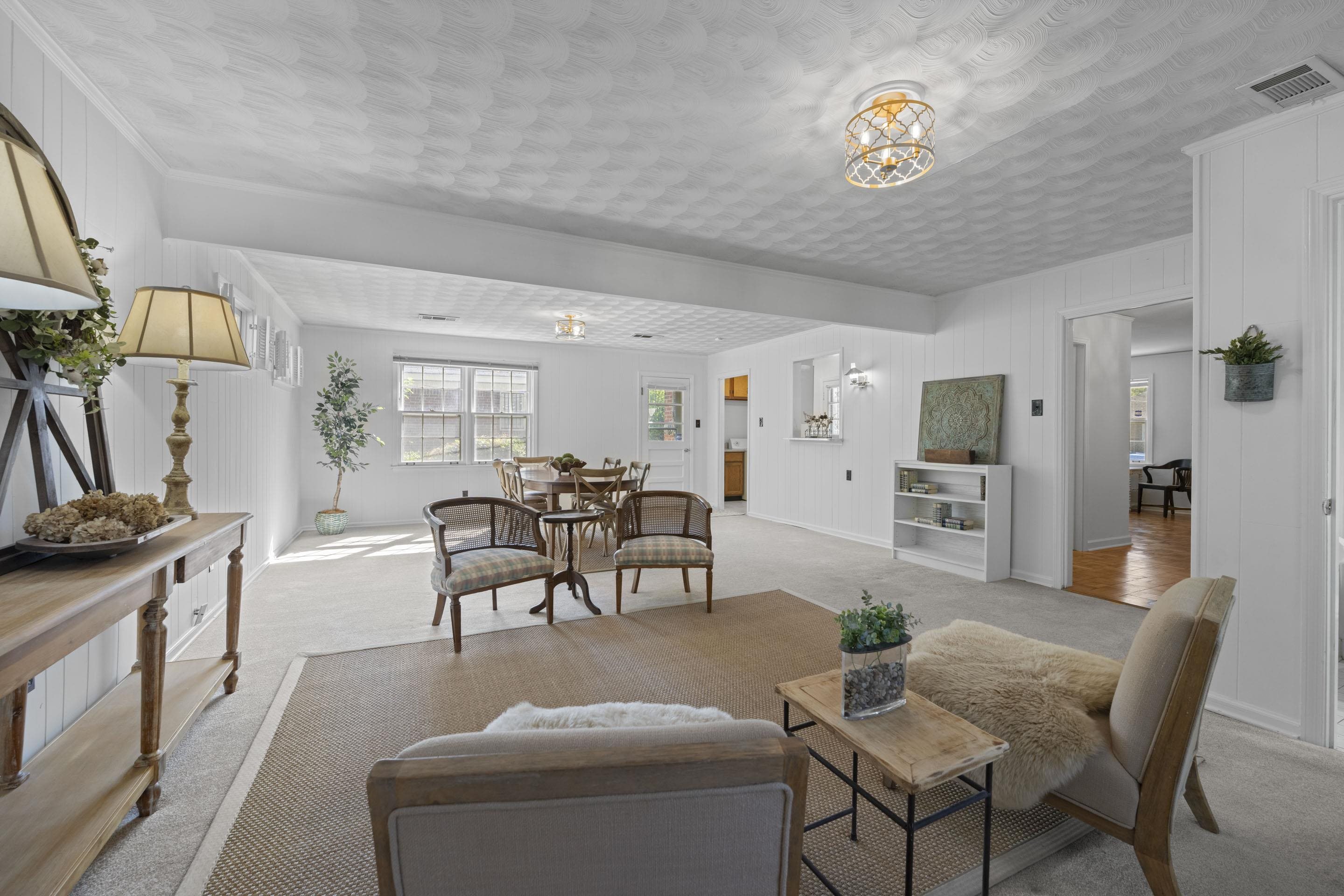 5076 Dee Road Memphis, TN 38117 - Photo 14 of 26 At the back of the house sits a large, warm great room that works beautifully as combined dining & living space — think dinners, movie nights, or gathering with friends.