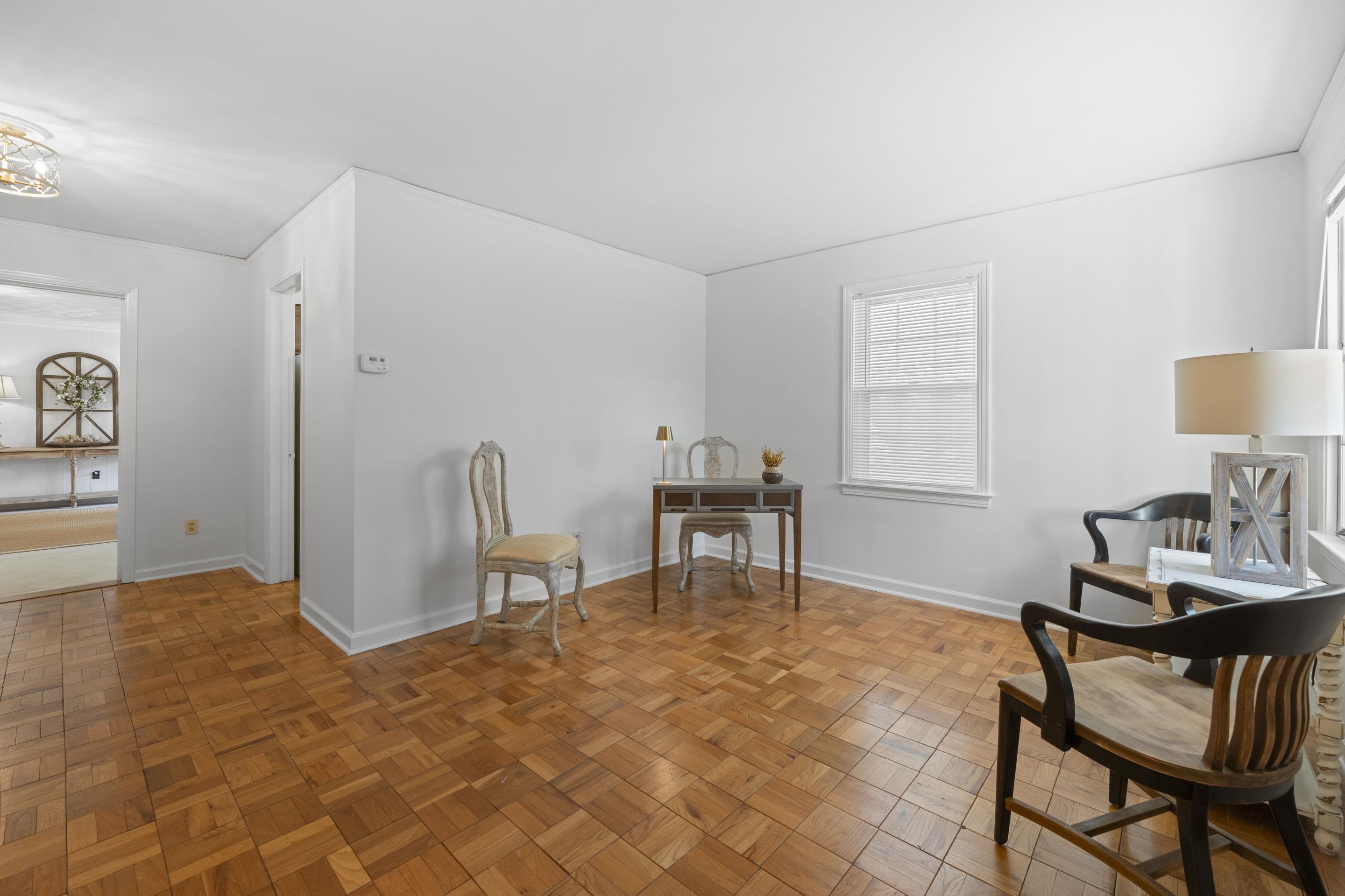5076 Dee Road Memphis, TN 38117 - Photo 15 of 26 This timeless living room offers a perfect balance of comfort and charm for both quiet nights and lively conversation.
