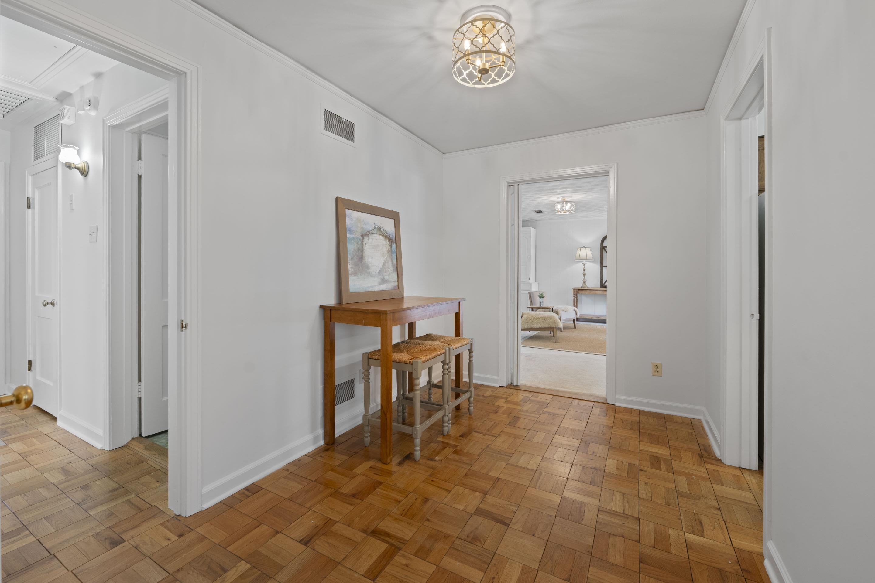 5076 Dee Road Memphis, TN 38117 - Photo 16 of 26 This extra-wide hallway opens seamlessly into the living room, enhancing the home’s bright, welcoming layout while offering room for décor.