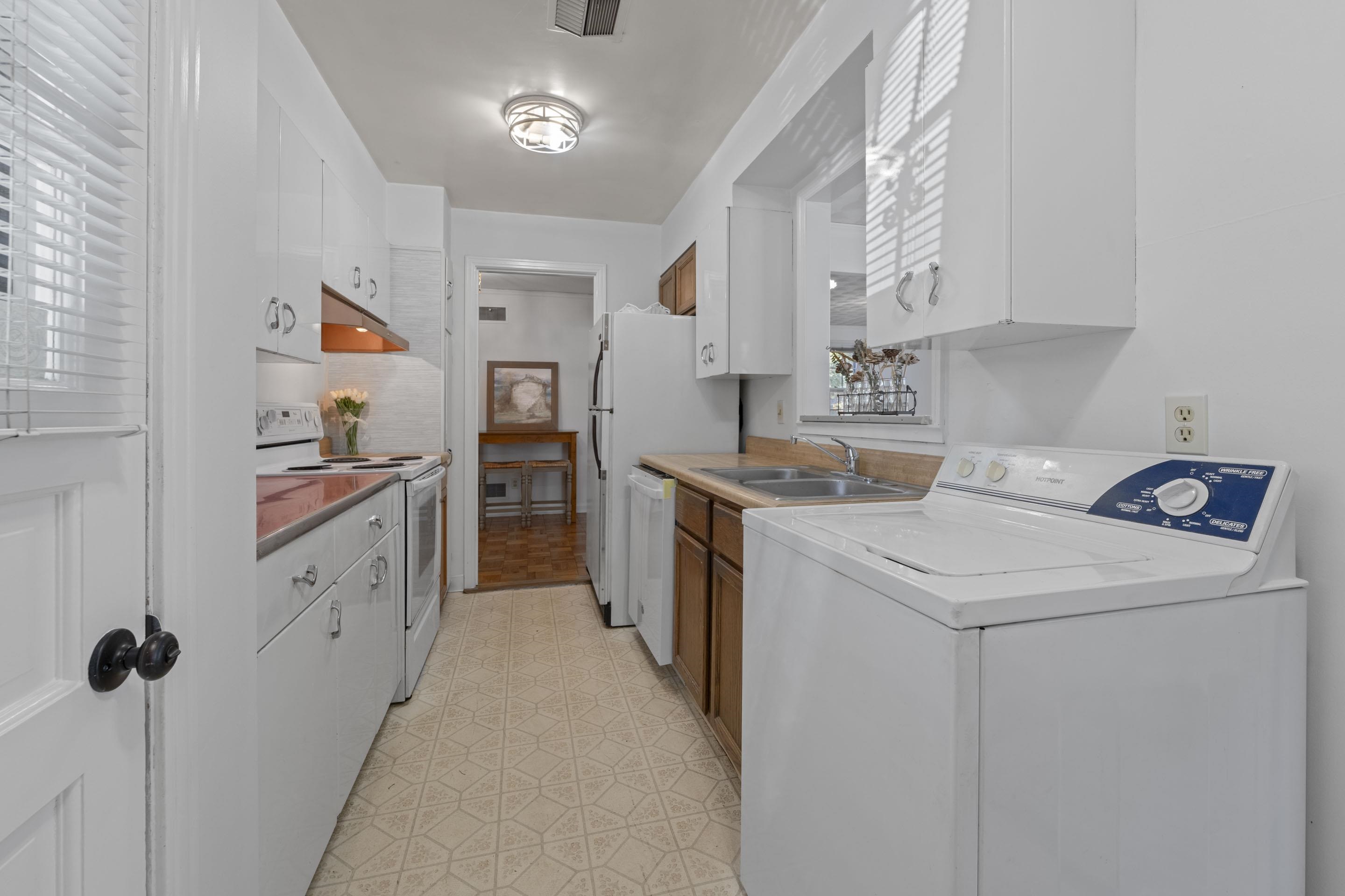 5076 Dee Road Memphis, TN 38117 - Photo 18 of 26 Equipped with a range, oven, refrigerator, and brand-new dishwasher, this kitchen balances classic function with convenience.