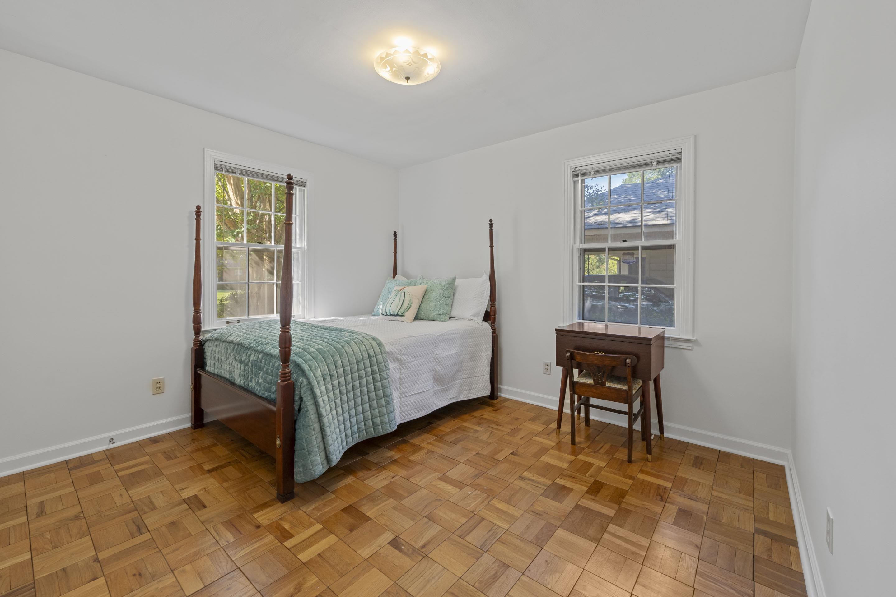 5076 Dee Road Memphis, TN 38117 - Photo 21 of 26 Featuring original hardwoods and neutral tones, this bedroom blends timeless style with modern ease.