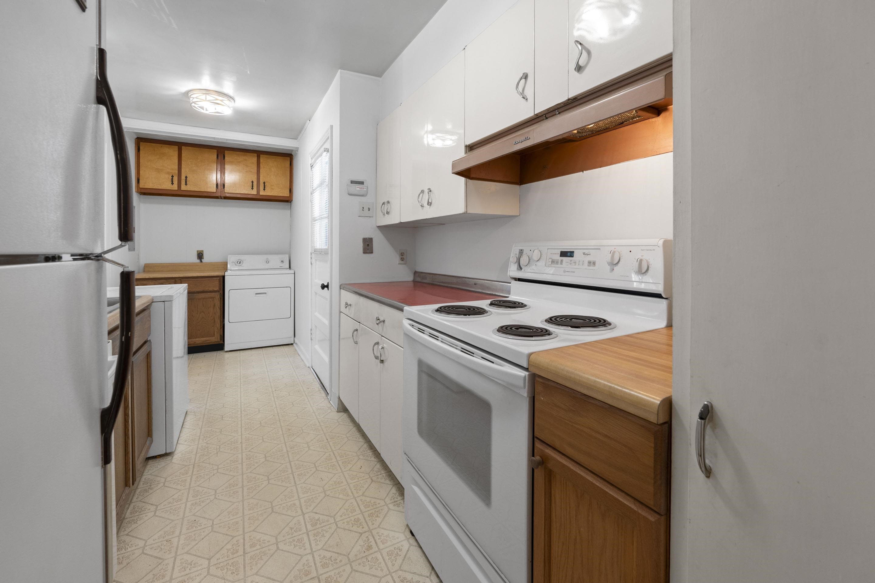 5076 Dee Road Memphis, TN 38117 - Photo 8 of 26 a kitchen with stainless steel appliances granite countertop a stove and a refrigerator