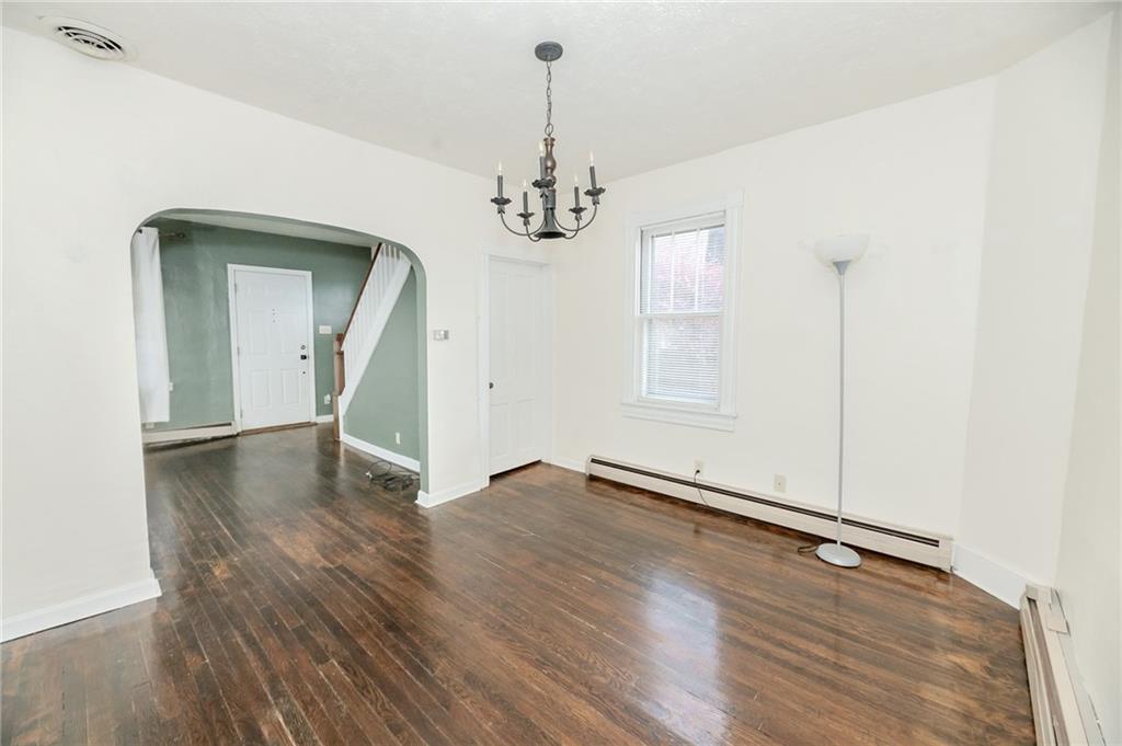 287 Main Street Ernest, PA 15739 - Photo 13 of 26 wooden floor in an empty room with a window