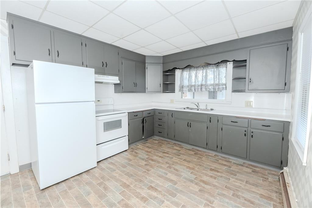 287 Main Street Ernest, PA 15739 - Photo 14 of 26 a kitchen with a white cabinets and white appliances