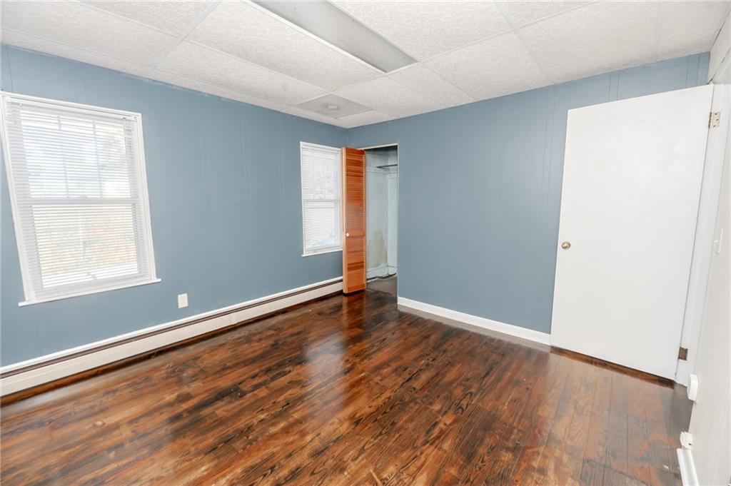 287 Main Street Ernest, PA 15739 - Photo 23 of 26 an empty room with wooden floor and windows