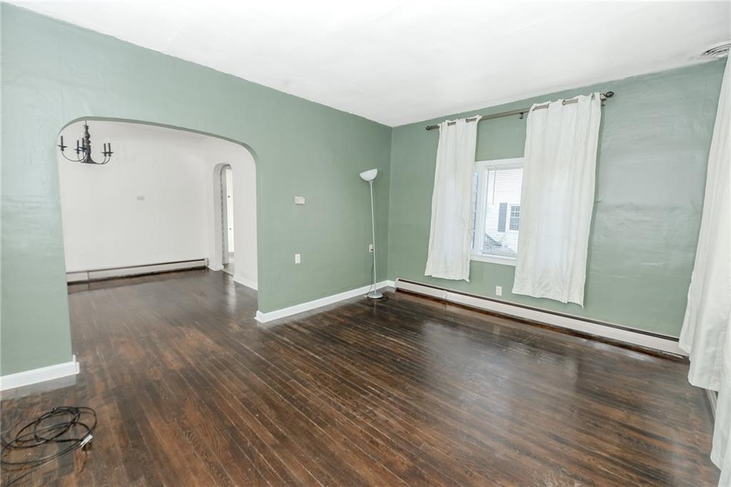 287 Main Street Ernest, PA 15739 - Photo 8 of 26 an empty room with wooden floor and windows