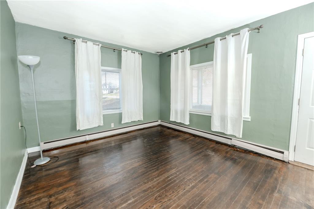 287 Main Street Ernest, PA 15739 - Photo 9 of 26 an empty room with wooden floor and windows