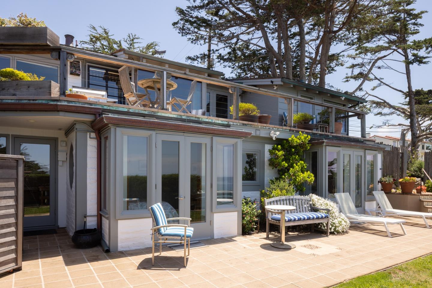 0 Scenic & 8th Corner Carmel, CA 93923 - Photo 2 of 27 a building outdoor space with patio furniture and potted plants