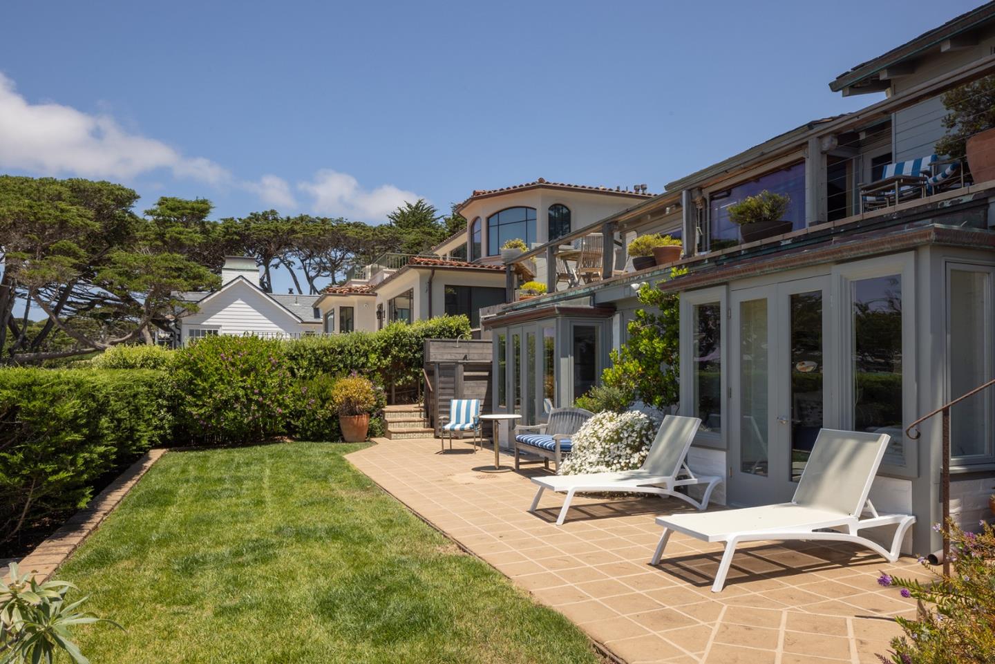 0 Scenic & 8th Corner Carmel, CA 93923 - Photo 22 of 27 a view of a patio with couches table and chairs and potted plants