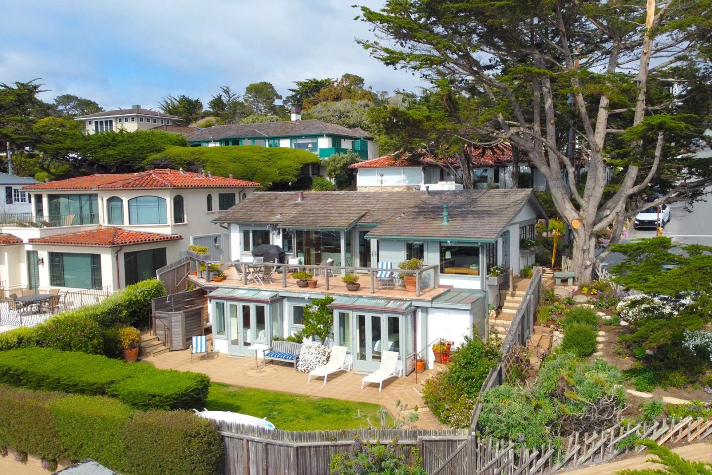 0 Scenic & 8th Corner Carmel, CA 93923 - Photo 23 of 27 a front view of a residential apartment building with a yard