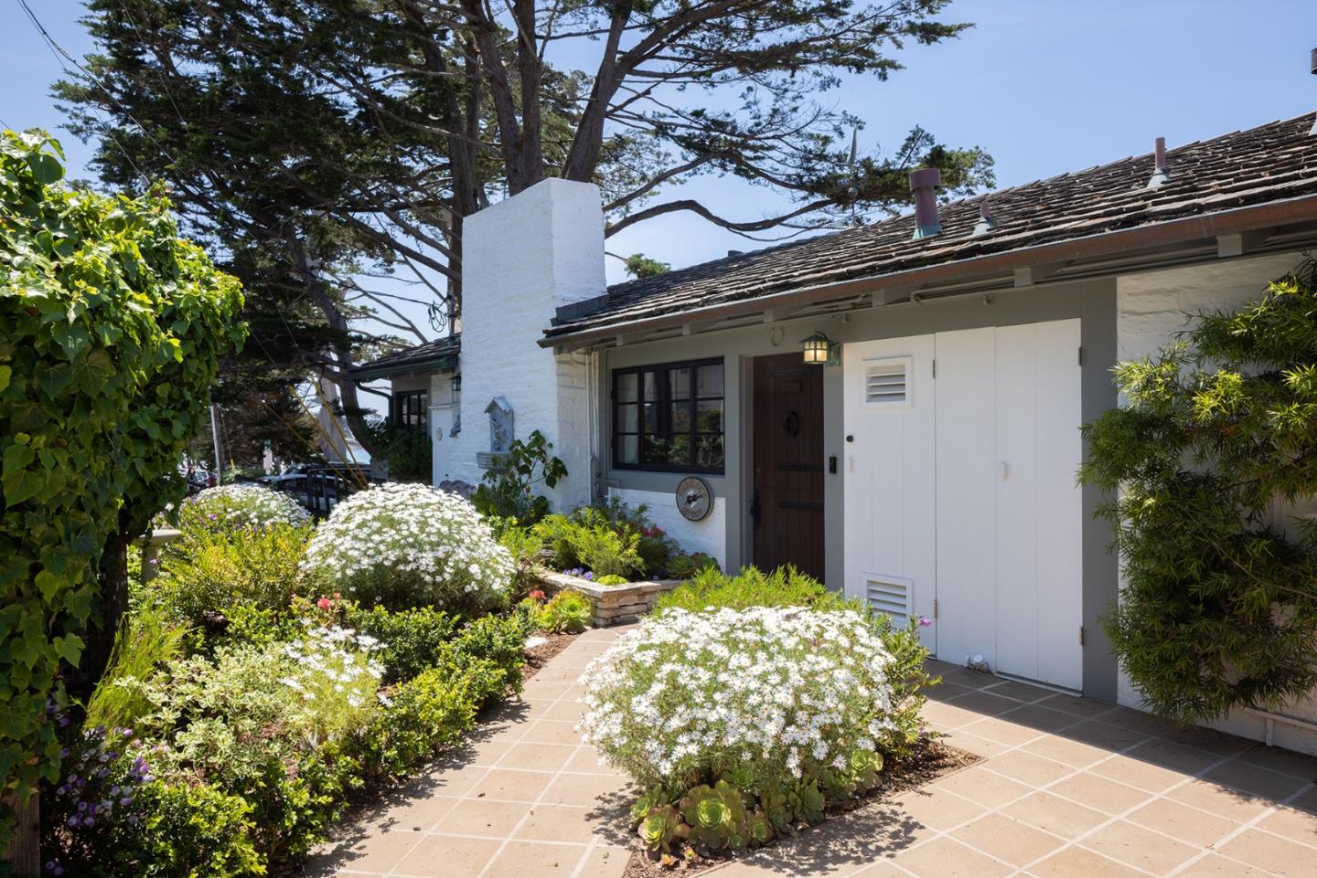 0 Scenic & 8th Corner Carmel, CA 93923 - Photo 6 of 27 a front view of a house with a yard