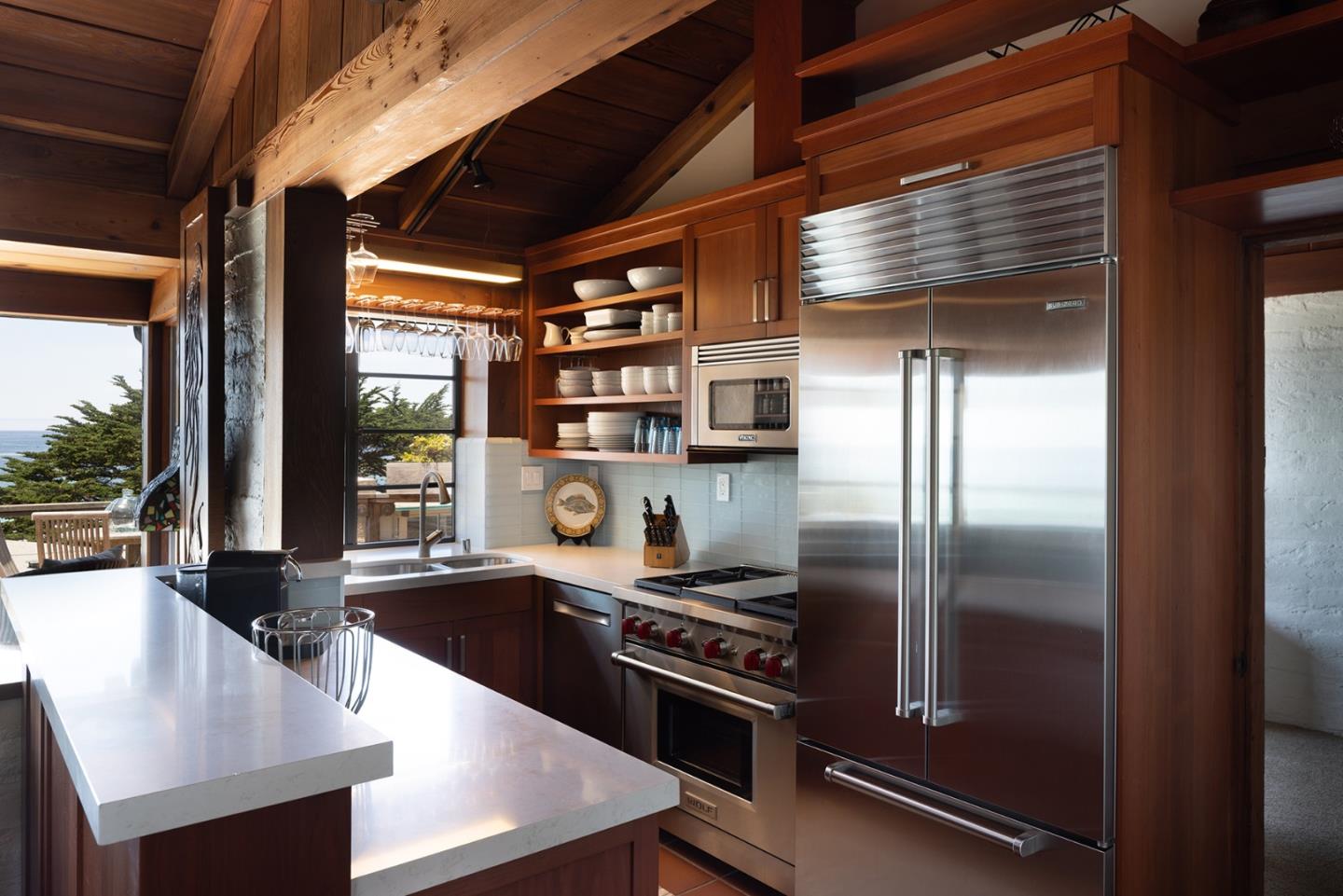 0 Scenic & 8th Corner Carmel, CA 93923 - Photo 10 of 27 a kitchen with stainless steel appliances granite countertop a refrigerator a stove and a view of living room