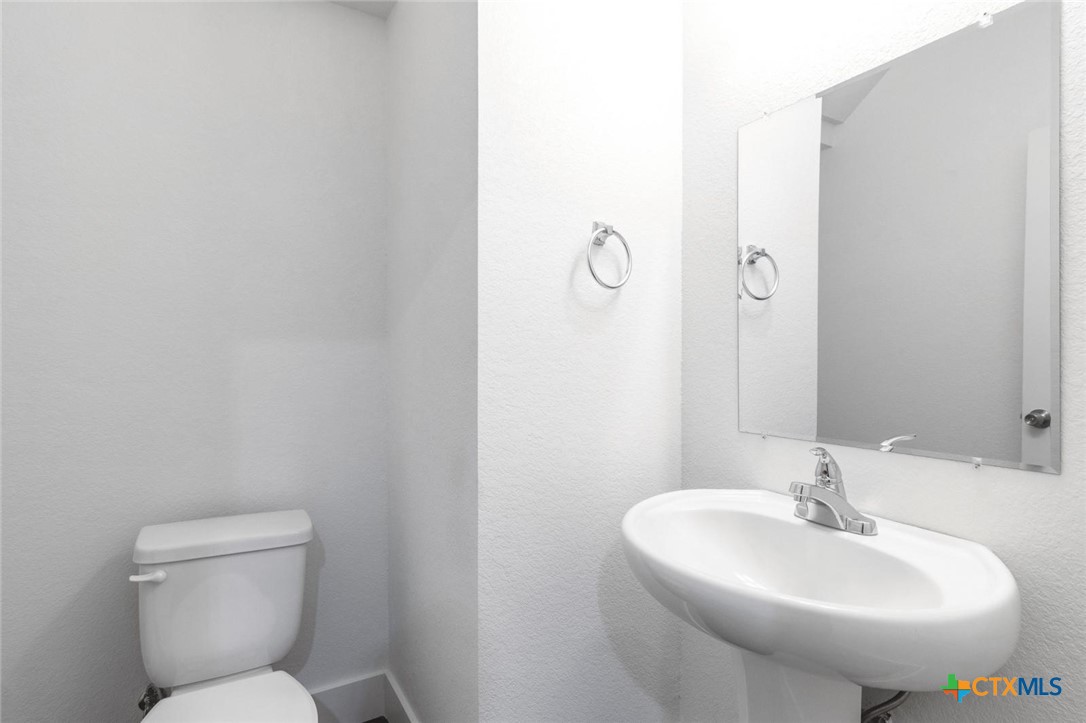 1904 Royal Loop Belton, TX 76513 - Photo 8 of 13 a bathroom with a sink mirror and toilet