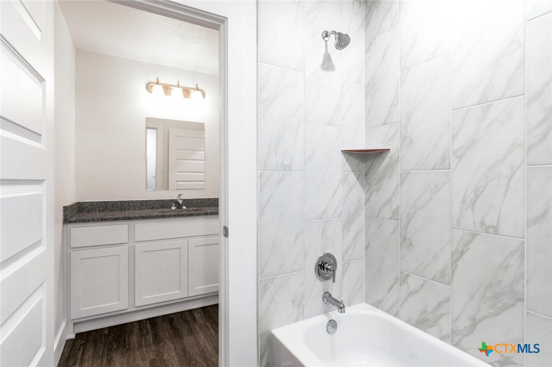 1904 Royal Loop Belton, TX 76513 - Photo 10 of 13 a bathroom with a bathtub and shower