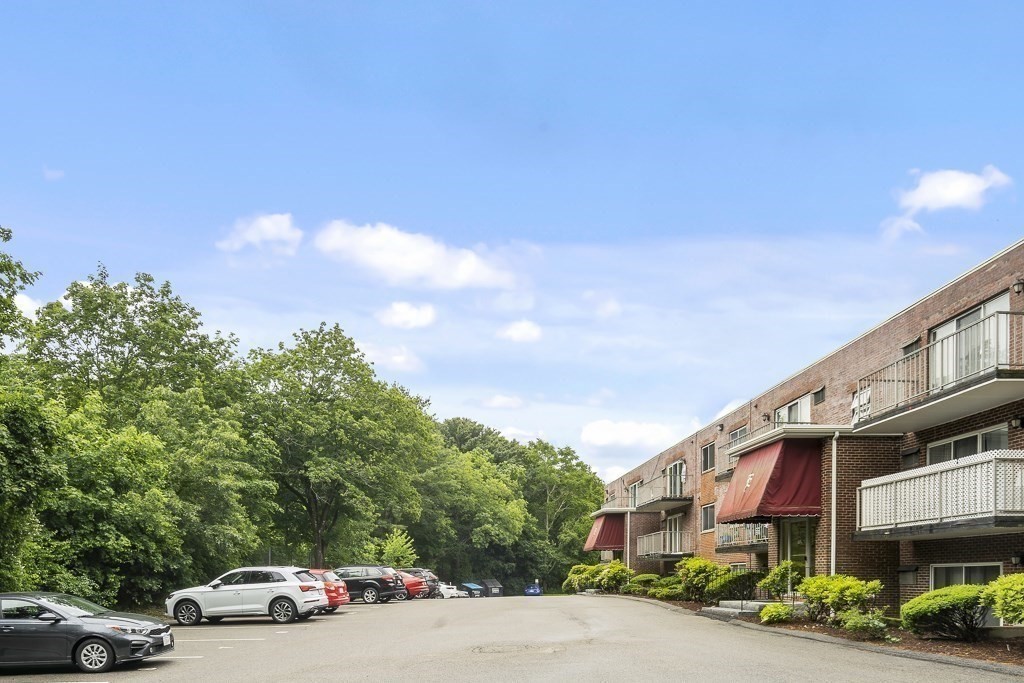 31 Hamlin Lane, Unit B11 Needham, MA 02492 - Photo 12 of 12 a car parked on the side of a street