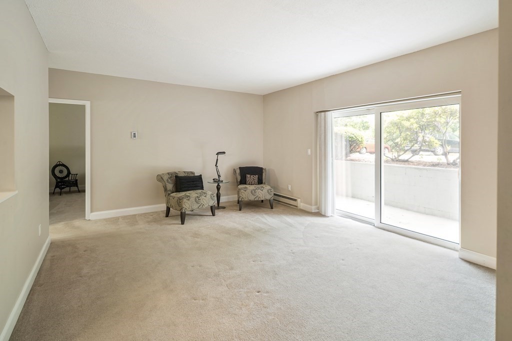 31 Hamlin Lane, Unit B11 Needham, MA 02492 - Photo 4 of 12 a living room with furniture and a window