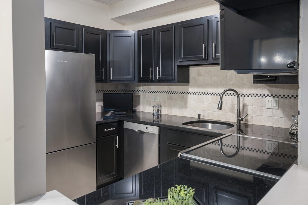 31 Hamlin Lane, Unit B11 Needham, MA 02492 - Photo 6 of 12 a kitchen with a sink and a stove
