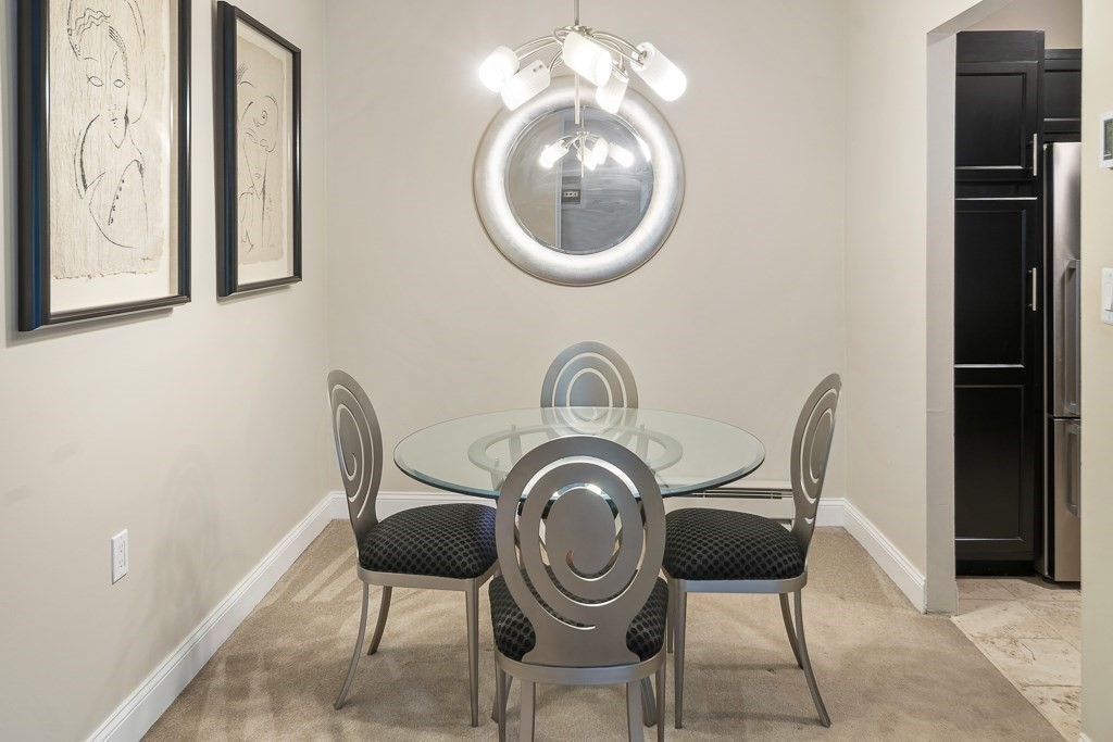 31 Hamlin Lane, Unit B11 Needham, MA 02492 - Photo 7 of 12 a view of dining room and kitchen with furniture