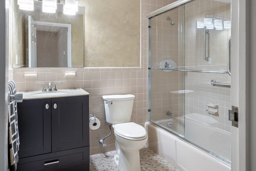 31 Hamlin Lane, Unit B11 Needham, MA 02492 - Photo 9 of 12 a bathroom with a sink a toilet and shower