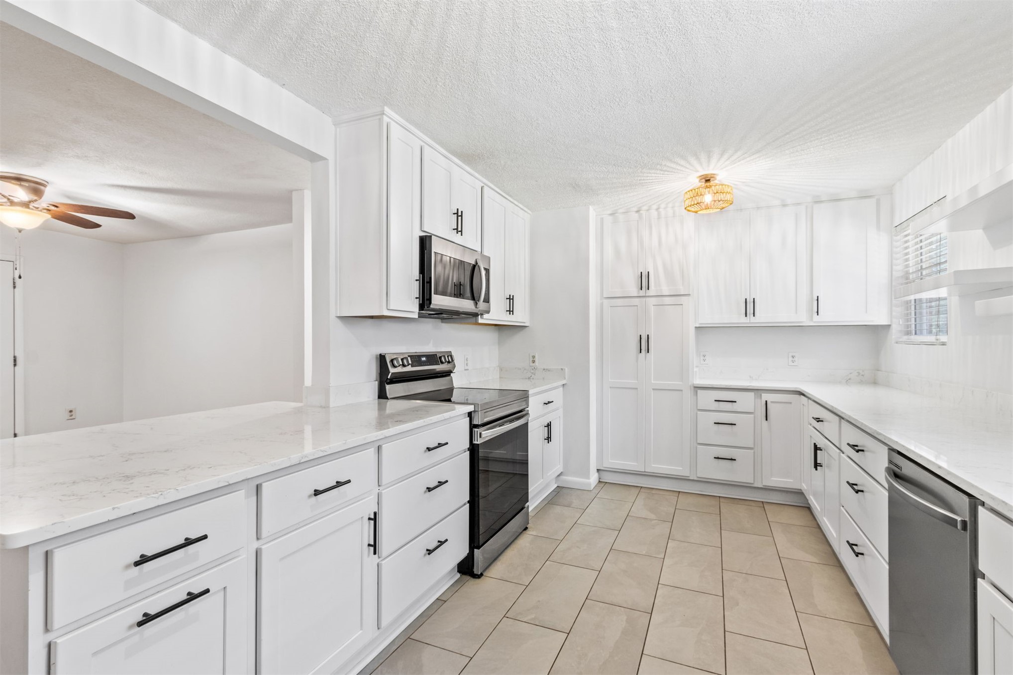 2441 Amelia Road Fernandina Beach, FL 32034 - Photo 2 of 36 a kitchen with cabinets and appliances