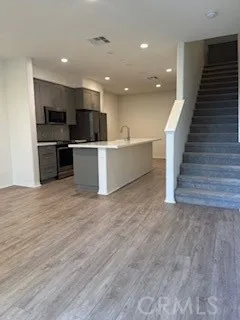 a view of kitchen with cabinets microwave and stove