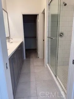 a bathroom with a shower and a sink