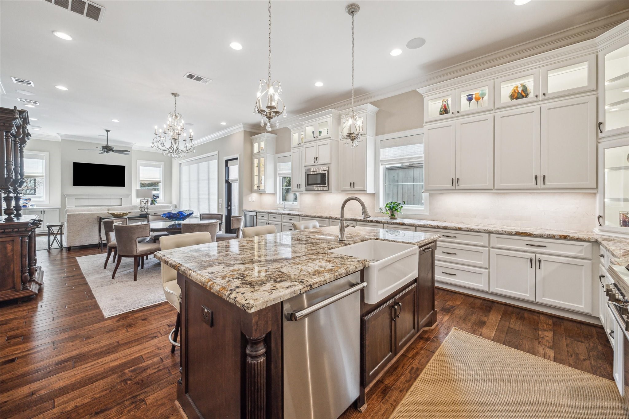 1523 Cunningham Parc Lane Houston, TX 77055 - Photo 37 of 37 a kitchen with stainless steel appliances granite countertop a stove top oven a sink dishwasher a dining table and chairs with wooden floor