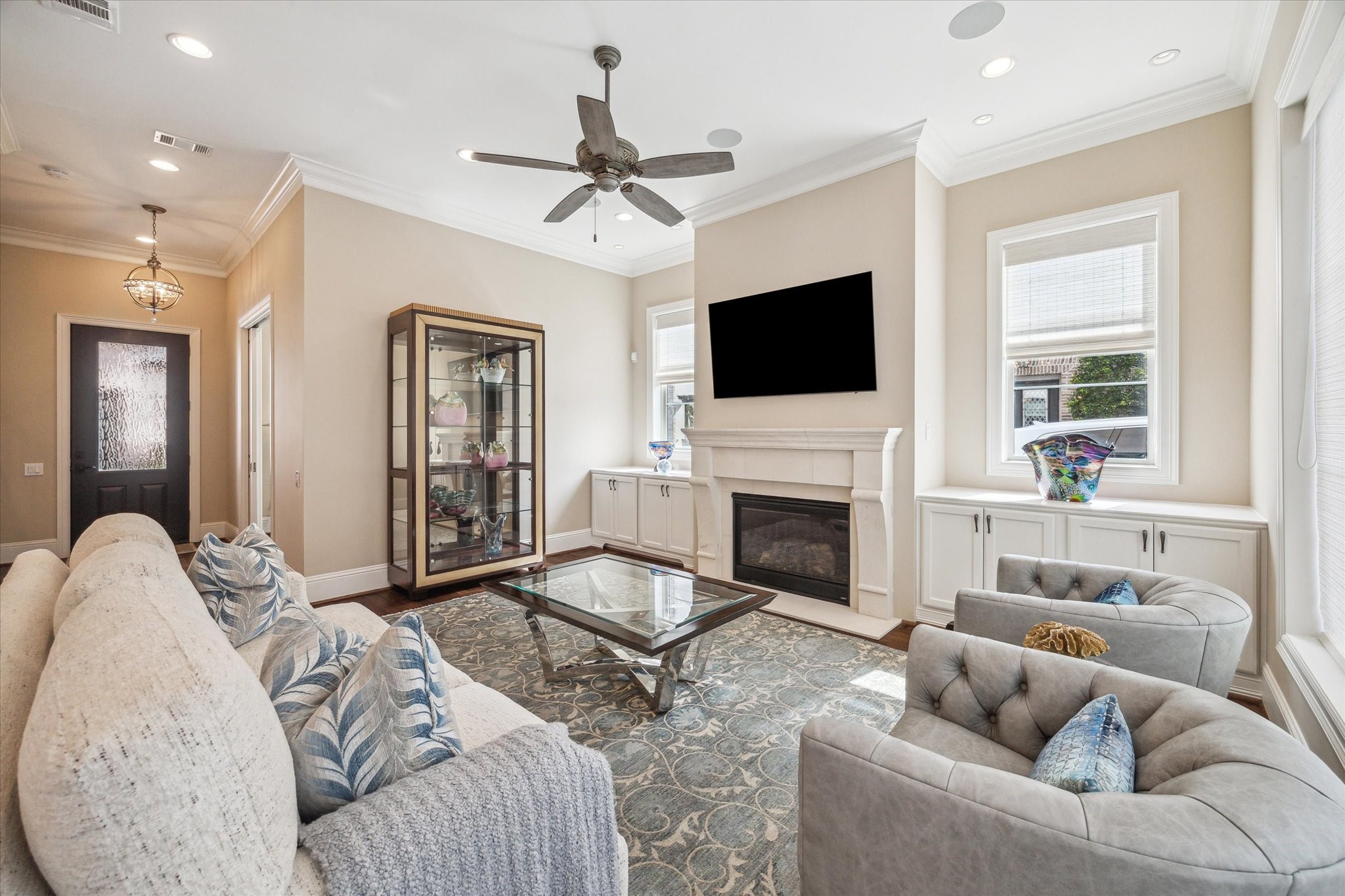 1523 Cunningham Parc Lane Houston, TX 77055 - Photo 5 of 37 a living room with furniture a fireplace and a flat screen tv