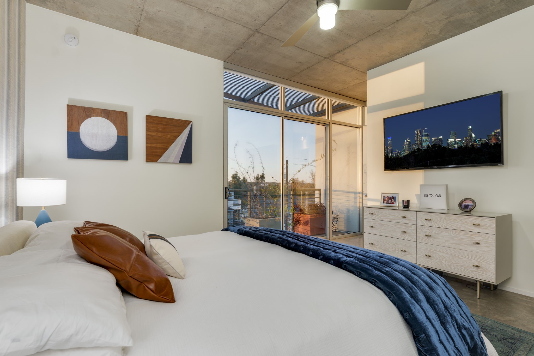 2301 South 5th Street, Unit 5 Austin, TX 78704 - Photo 24 of 39 Bedroom featuring access to outside and ceiling fan