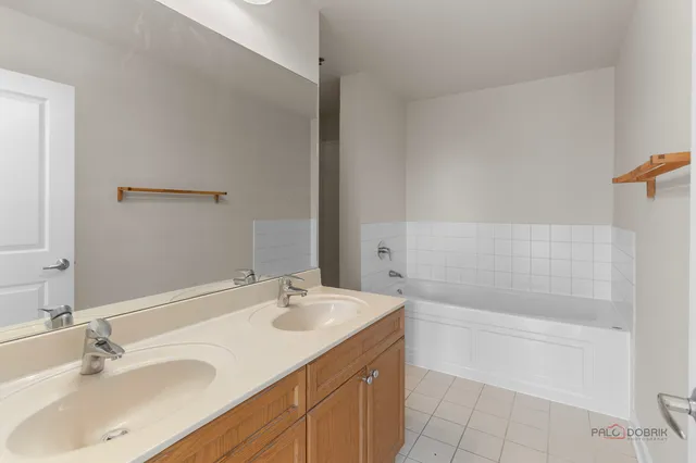 a bathroom with a sink a shower and a mirror