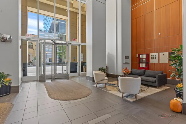 a view of a patio with couches and potted plants