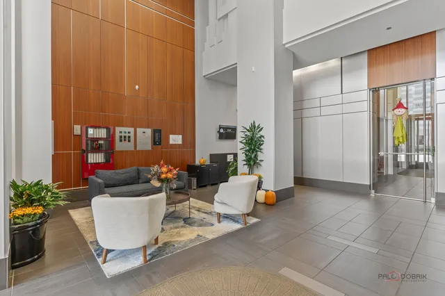 a living room with furniture and flowers
